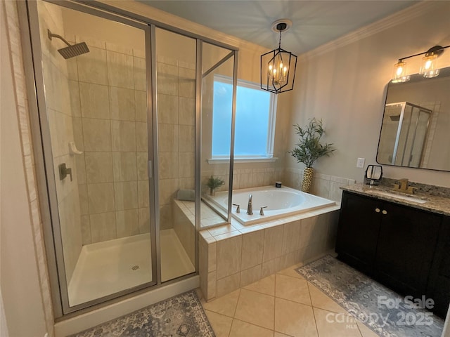 full bath with a shower stall, tile patterned flooring, a bath, crown molding, and a chandelier