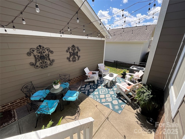 view of patio with fence and an outdoor living space