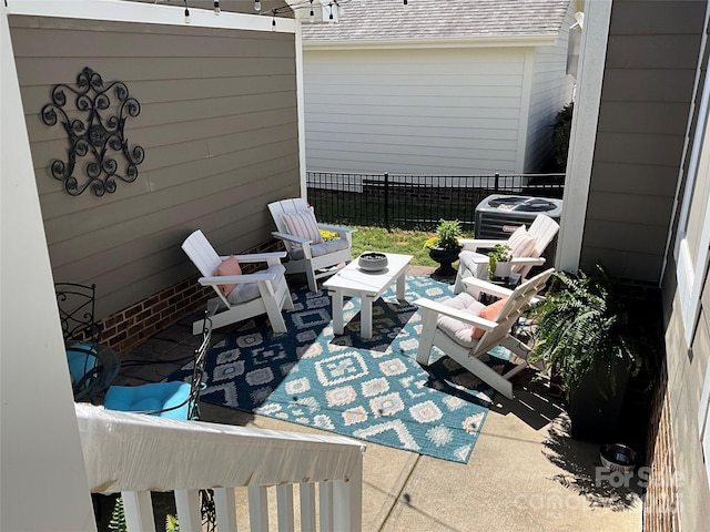 view of patio / terrace featuring fence and central air condition unit