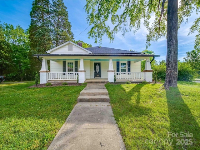 300 W 12th St, Salisbury, NC 28144 - bungalow featuring a porch, a front lawn, and a chimney