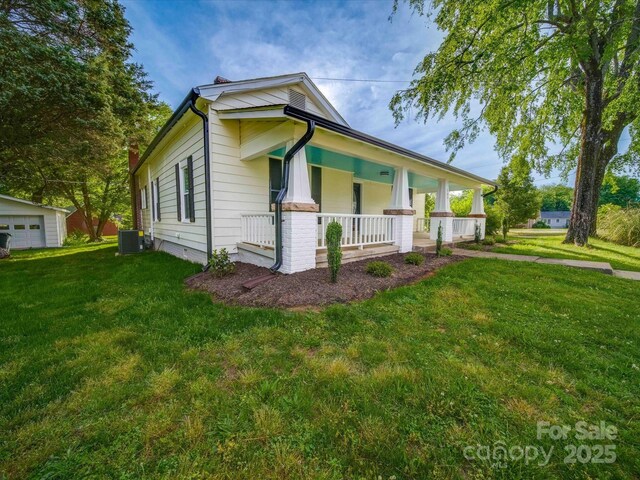 300 W 12th St, Salisbury, NC 28144 - view of front of property featuring a porch, a front yard, and an outdoor structure