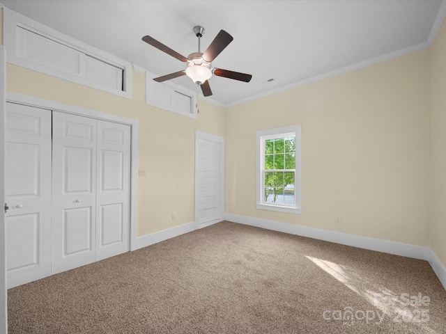 300 W 12th St, Salisbury, NC 28144 - unfurnished bedroom featuring carpet, baseboards, ornamental molding, a closet, and ceiling fan