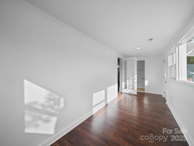 300 W 12th St, Salisbury, NC 28144 - unfurnished room featuring french doors, baseboards, wood finished floors, and recessed lighting