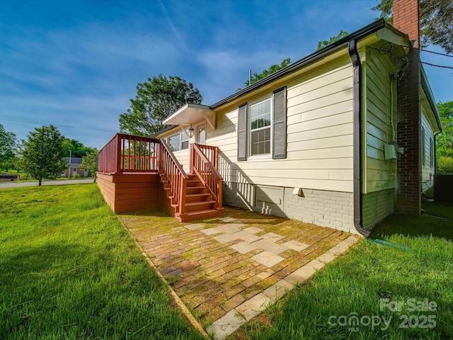 300 W 12th St, Salisbury, NC 28144 - back of property featuring a lawn, a chimney, a patio area, and crawl space