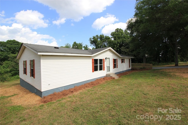 view of property exterior featuring crawl space and a yard