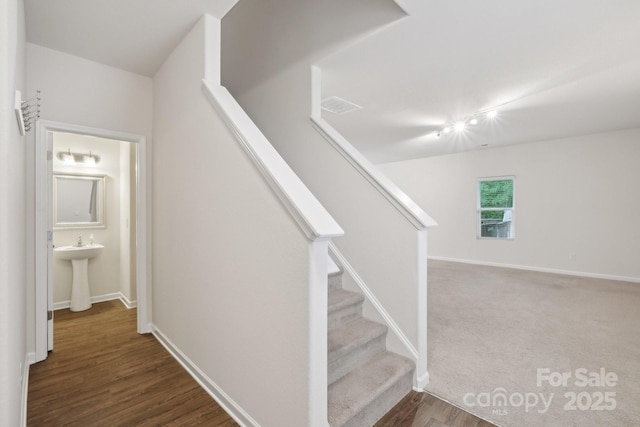 1835 Allegheny Dr, Gastonia, NC 28054 - stairs with baseboards and wood finished floors