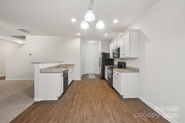 1835 Allegheny Dr, Gastonia, NC 28054 - kitchen featuring stainless steel appliances, a sink, baseboards, white cabinets, and recessed lighting