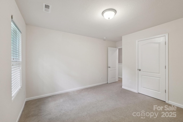 1835 Allegheny Dr, Gastonia, NC 28054 - unfurnished bedroom with carpet flooring, multiple windows, and baseboards