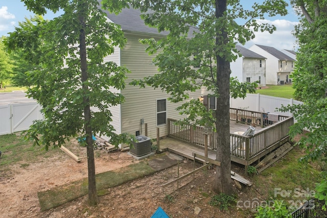 1835 Allegheny Dr, Gastonia, NC 28054 - back of property featuring a wooden deck, a fenced backyard, central AC, and a gate