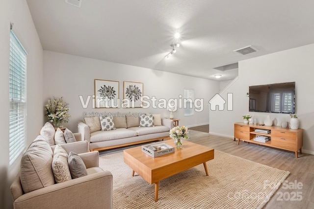 1835 Allegheny Dr, Gastonia, NC 28054 - living area featuring light wood-style floors, baseboards, and track lighting