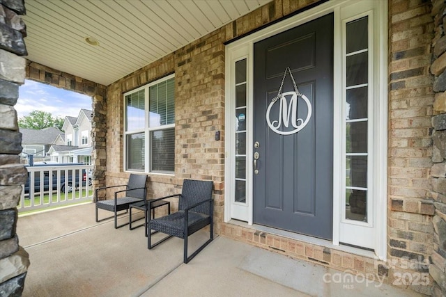 862 Kathy Dianne Dr, Fort Mill, SC 29707 - property entrance featuring a porch, stone siding, and brick siding
