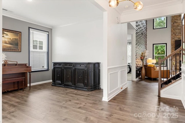 862 Kathy Dianne Dr, Fort Mill, SC 29707 - living room with ornamental molding, healthy amount of natural light, stairs, wood finished floors, and a chandelier