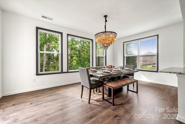 862 Kathy Dianne Dr, Fort Mill, SC 29707 - dining area with a chandelier, wood finished floors, and baseboards