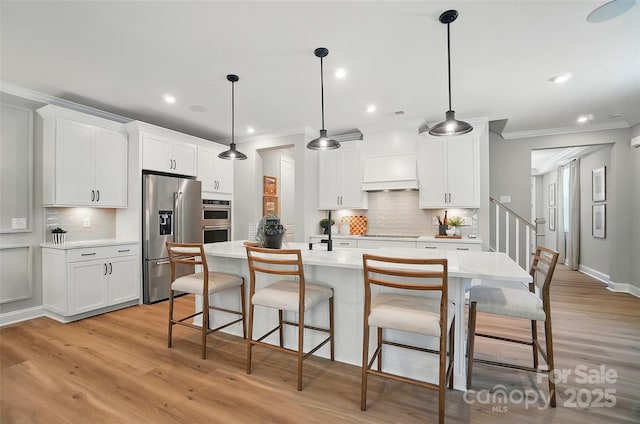 12047 Lavinia Ln, Charlotte, NC 28277 - kitchen with stainless steel appliances, ornamental molding, light countertops, decorative backsplash, and light wood finished floors