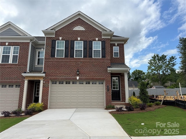 12047 Lavinia Ln, Charlotte, NC 28277 - view of front of property featuring concrete driveway, brick siding, an attached garage, and a front lawn
