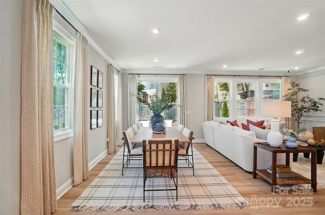 12047 Lavinia Ln, Charlotte, NC 28277 - dining space featuring ornamental molding, light wood-type flooring, recessed lighting, plenty of natural light, and baseboards