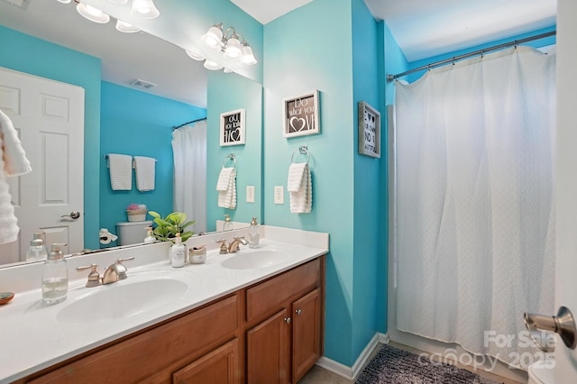 2763 Rivendale Ct, Indian Land, SC 29707 - full bathroom featuring toilet, double vanity, and a shower with shower curtain