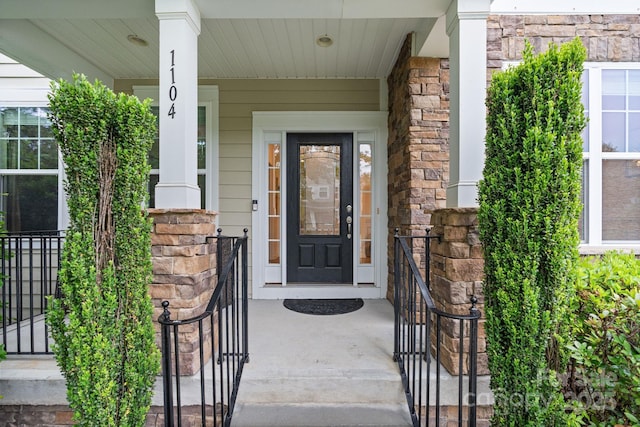 1104 Snowbird Ln, Waxhaw, NC 28173 - view of exterior entry featuring a porch and stone siding