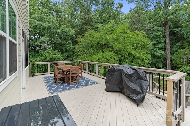 1104 Snowbird Ln, Waxhaw, NC 28173 - wooden terrace with outdoor dining area and view of wooded area