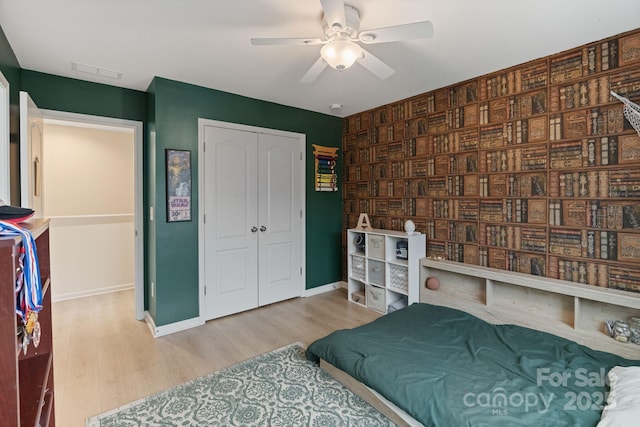 1104 Snowbird Ln, Waxhaw, NC 28173 - bedroom with wood finished floors, baseboards, and a closet