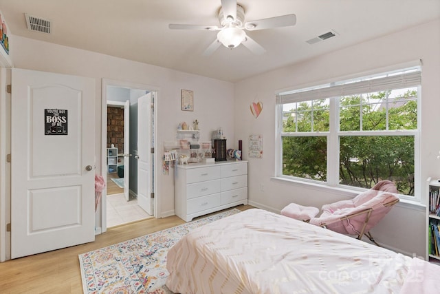 1104 Snowbird Ln, Waxhaw, NC 28173 - bedroom featuring light wood-type flooring, a ceiling fan, and baseboards