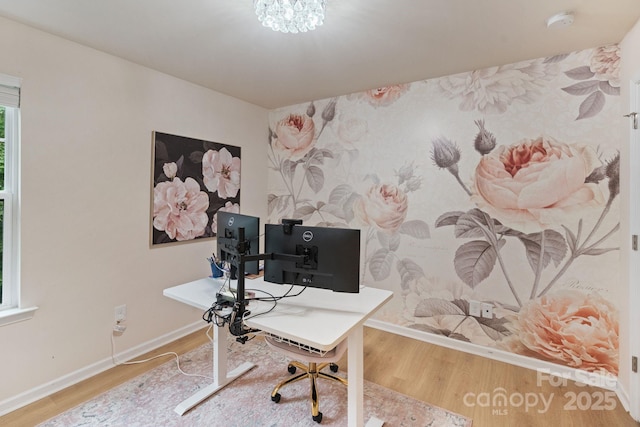 1104 Snowbird Ln, Waxhaw, NC 28173 - office area with wallpapered walls, baseboards, wood finished floors, and an accent wall
