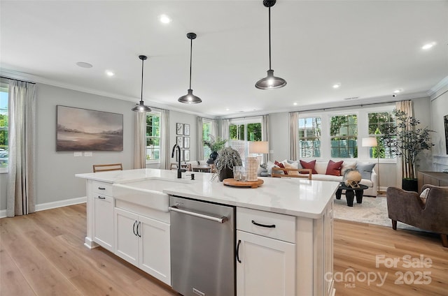 12055 Lavinia Ln, Charlotte, NC 28277 - kitchen featuring dishwasher, a sink, crown molding, light wood finished floors, and white cabinetry