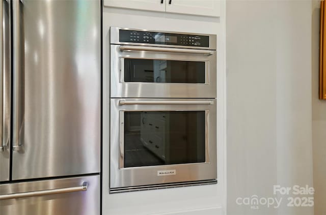 12055 Lavinia Ln, Charlotte, NC 28277 - kitchen featuring appliances with stainless steel finishes and white cabinets