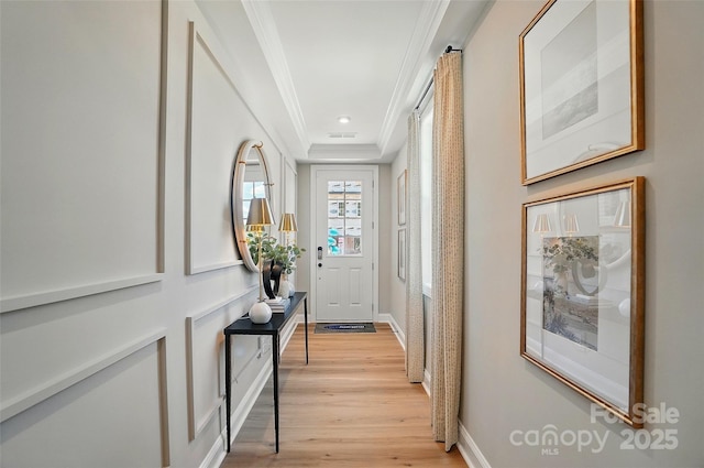 12055 Lavinia Ln, Charlotte, NC 28277 - doorway featuring crown molding, light wood-style flooring, and baseboards