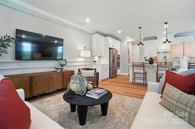 12055 Lavinia Ln, Charlotte, NC 28277 - living area with crown molding, light wood-style floors, and recessed lighting