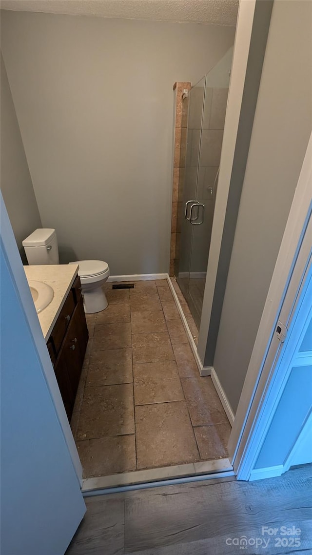 824 S Laurel St, Lincolnton, NC 28092 - full bath featuring toilet, a shower stall, vanity, and baseboards