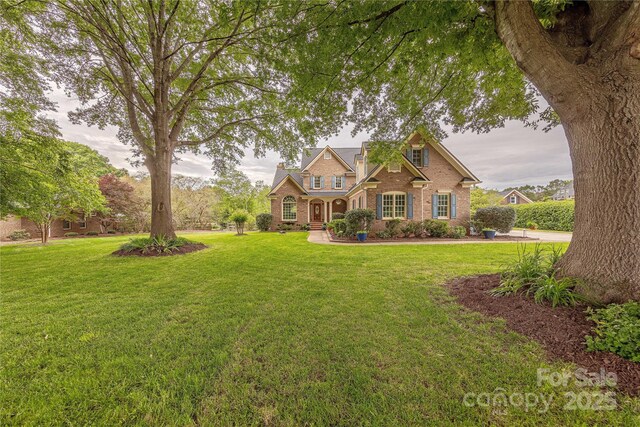 6024 Highview Rd, Weddington, NC 28104 - traditional-style house featuring brick siding and a front yard