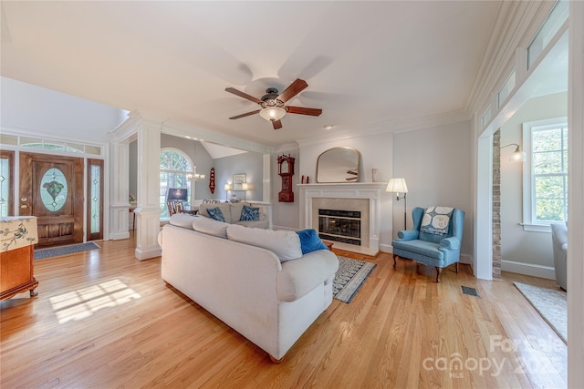 6024 Highview Rd, Weddington, NC 28104 - living area with ornate columns, ceiling fan, light wood-style flooring, a fireplace with flush hearth, and ornamental molding