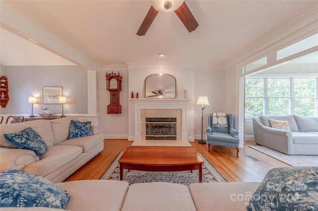 6024 Highview Rd, Weddington, NC 28104 - living area featuring ceiling fan, wood finished floors, a fireplace with flush hearth, ornamental molding, and baseboards