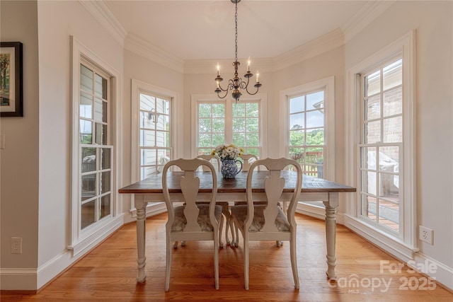 6024 Highview Rd, Weddington, NC 28104 - dining space with a chandelier, light wood-style floors, crown molding, and baseboards