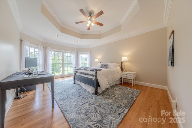 6024 Highview Rd, Weddington, NC 28104 - bedroom with a tray ceiling, wood finished floors, crown molding, a desk, and baseboards