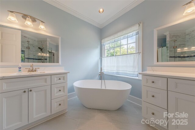6024 Highview Rd, Weddington, NC 28104 - bathroom with a stall shower, baseboards, two vanities, ornamental molding, and a soaking tub