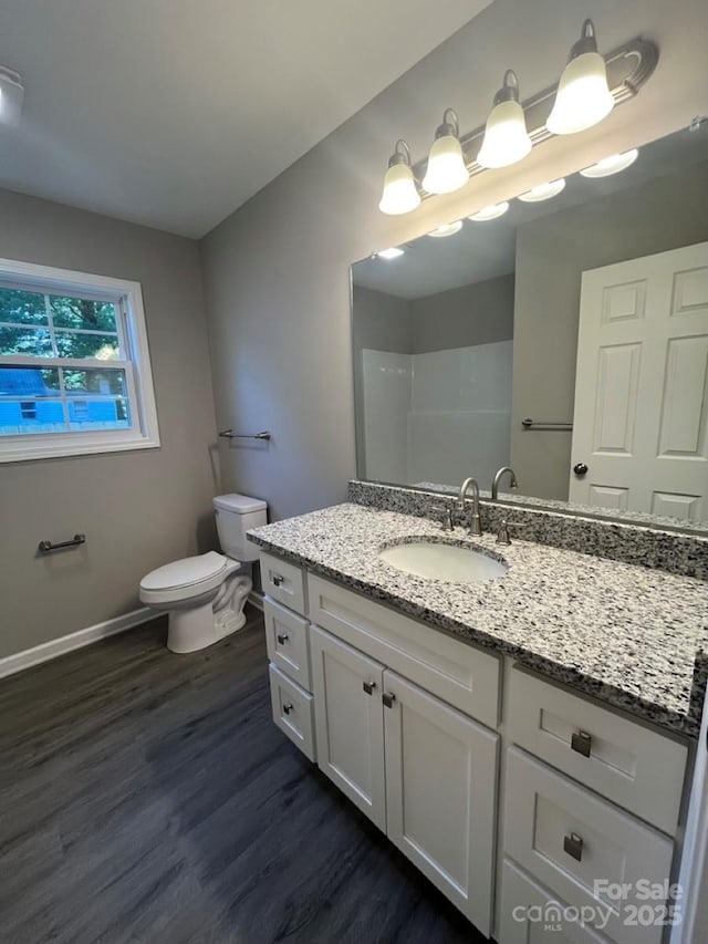 1024 Short St, Salisbury, NC 28144 - full bath featuring wood finished floors, vanity, and a shower