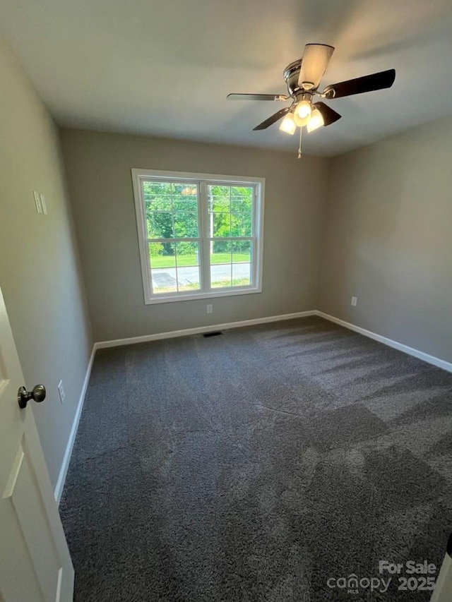 1024 Short St, Salisbury, NC 28144 - spare room featuring a ceiling fan and dark carpet