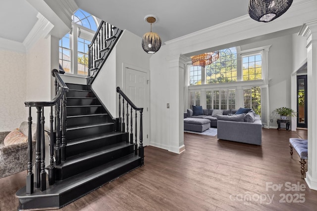 9625 Donna Ve Ln, Charlotte, NC 28277 - staircase featuring a high ceiling, wood finished floors, ornamental molding, and baseboards