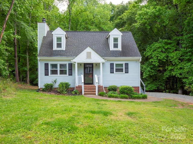 8905 Vagabond Rd, Mint Hill, NC 28227 - cape cod-style house with a front lawn, a chimney, and a shingled roof