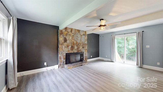 8905 Vagabond Rd, Mint Hill, NC 28227 - unfurnished living room featuring baseboards, wood finished floors, a fireplace, a ceiling fan, and beamed ceiling