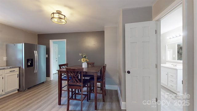 8905 Vagabond Rd, Mint Hill, NC 28227 - dining space featuring light wood finished floors and baseboards