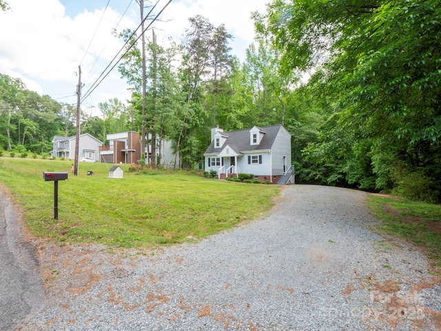 8905 Vagabond Rd, Mint Hill, NC 28227 - cape cod-style house featuring gravel driveway, a front lawn, and crawl space