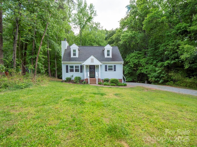8905 Vagabond Rd, Mint Hill, NC 28227 - cape cod house featuring a front yard, a chimney, and gravel driveway