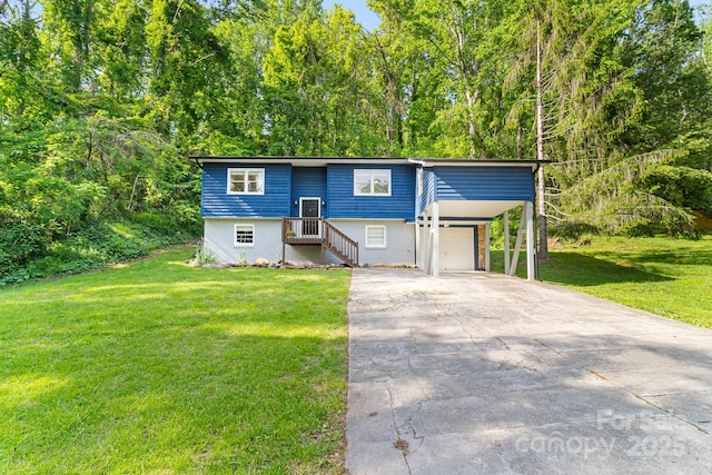bi-level home featuring concrete driveway, a front lawn, and an attached garage