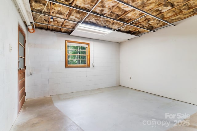 below grade area with concrete block wall