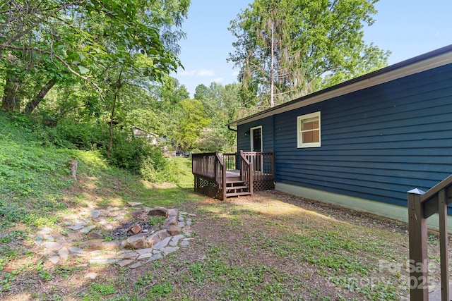view of yard with a wooden deck