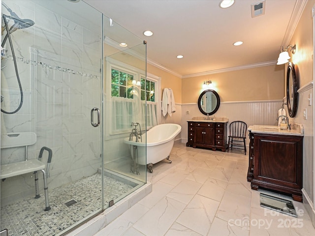 4951 Dayspring Dr, Mint Hill, NC 28227 - bathroom featuring marble look tiles, a stall shower, two vanities, a wainscoted wall, and a freestanding tub