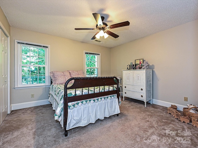4951 Dayspring Dr, Mint Hill, NC 28227 - carpeted bedroom featuring baseboards, a textured ceiling, and a ceiling fan